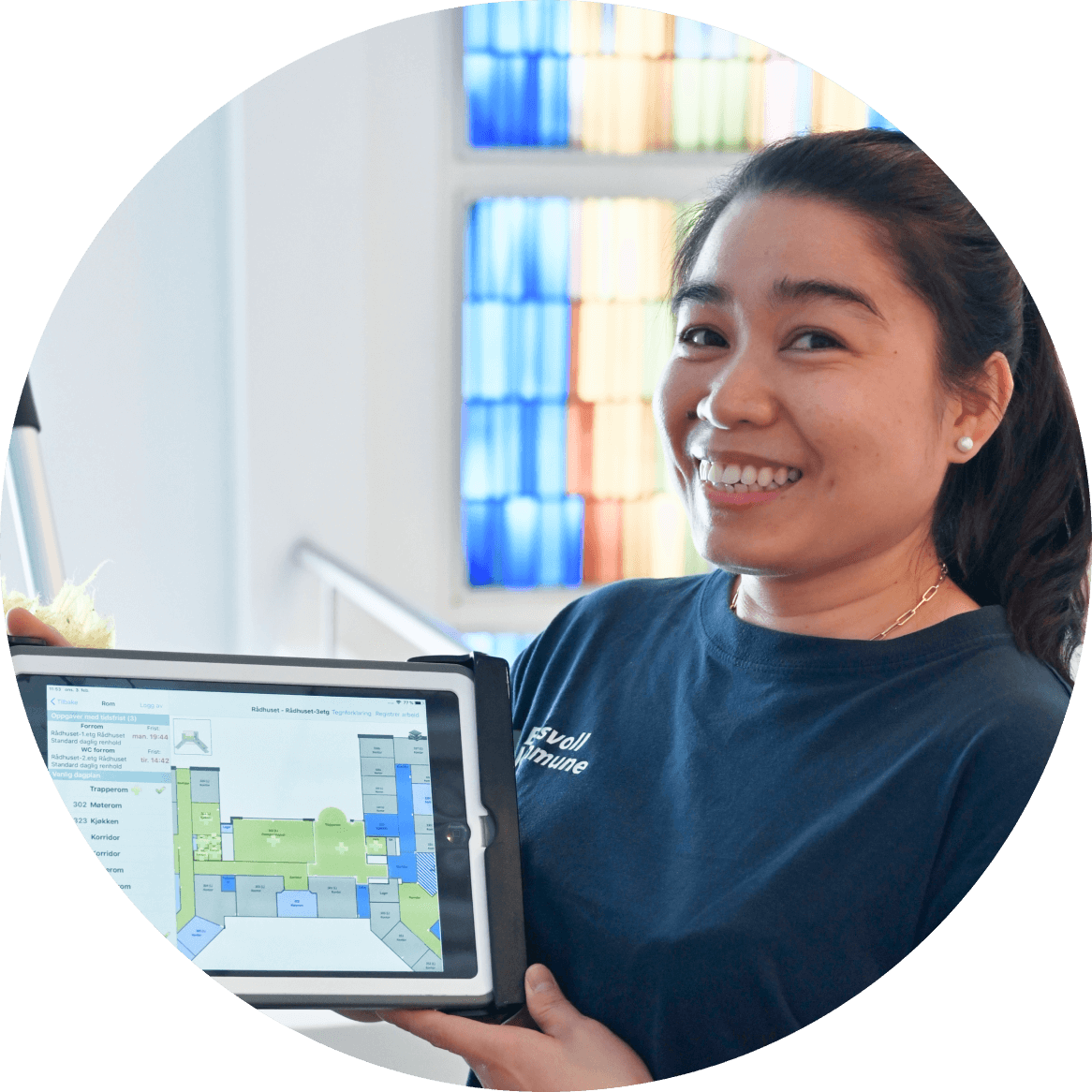a woman is holding a tablet